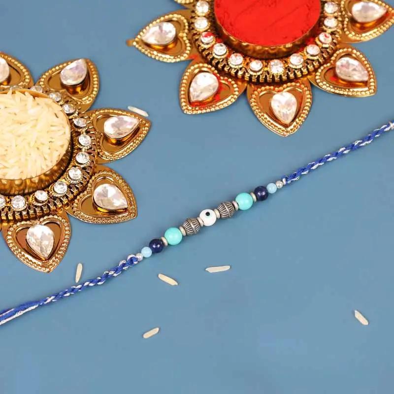 Evil Eye Rakhi and Tin Rasgulla