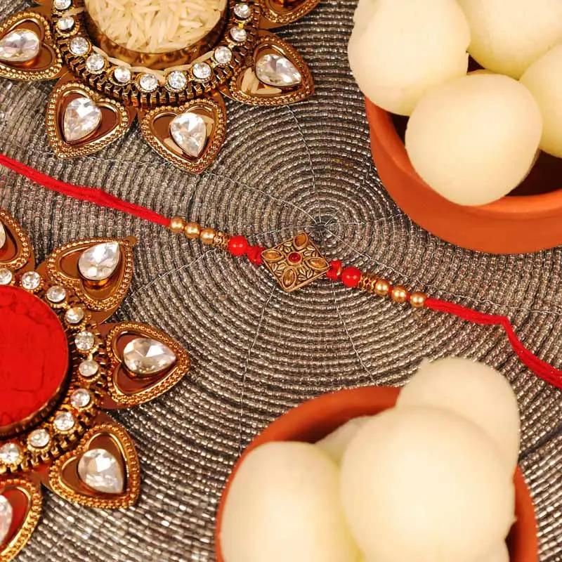 Kundan Rakhi and Tin Rasgulla